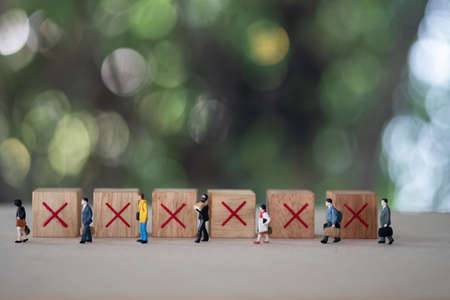 Miniature people keeping distance for infection risk and disease for prevent virus Covid-19. Social Distancing concept. Health care concept.の写真素材