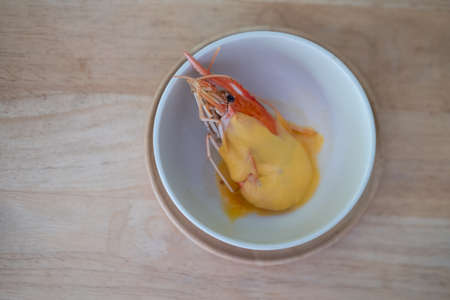 Homemade of big shrimp and cheese in bowl on wood table