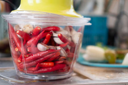 Hot red pepper and garlic in a blender prepare for cooking Thailand foodの写真素材