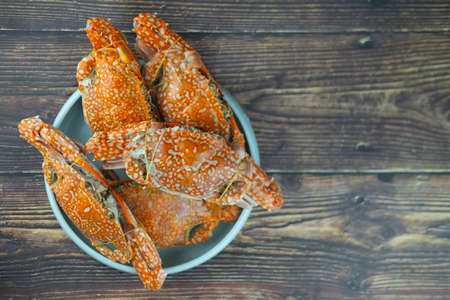 Big fresh steamed crab in plate on wood table. Thailand seafoodの写真素材