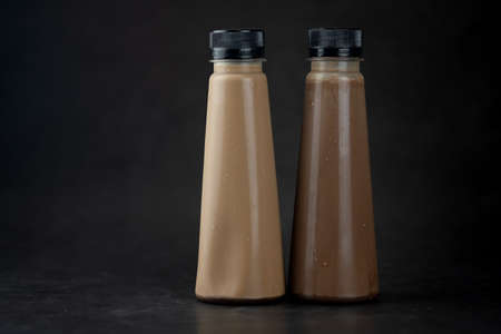 Dark chocolate bottle and milk chocolate for weight loss. Design for food and nutrition.の写真素材