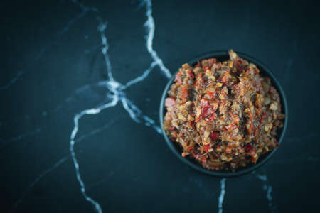 Jaew Bon chili paste or (Jaew pickled fish) in black bowl on black background. Thai style chiliの写真素材