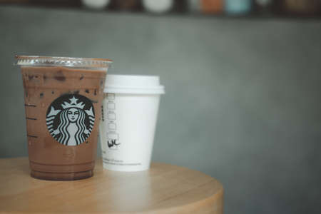 Bangkok, Thailand - June 9, 2020:  Iced mocha in takeaway glass on table at Starbucks. Beverage by coffee brand originated in USAのeditorial素材