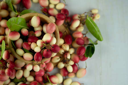 Carunda or Karonda close up in bowl. Top viewの写真素材