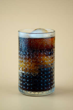 Fresh cool glass of soft drink with ice. Refreshment drink