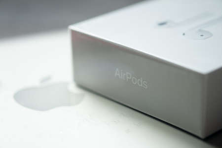 Bangkok, Thailand - June 10, 2020: Close up of Box AirPods wireless headphones  and Apple Inc logoのeditorial素材