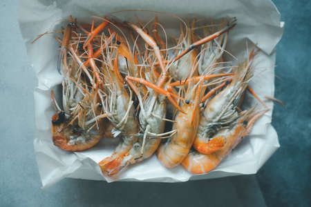 Delicious grilled shrimp in foam box package. Thai cuisine seafood.の写真素材