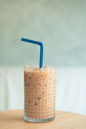 Iced Mocha coffee in glass on table. Cafe photography concept.