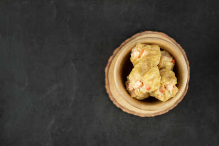 Group of hot stream shrimp dumpling on wood bowlの写真素材