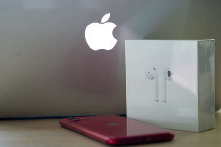 Bangkok, Thailand - June 19, 2020 : Apple Inc. Product Design Airpods, a smartphone and red Iphone 11. Technology gadgetのeditorial素材