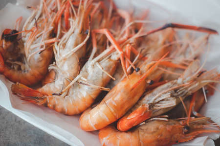 Delicious grilled shrimp in foam box package. Thai cuisine seafood.の写真素材