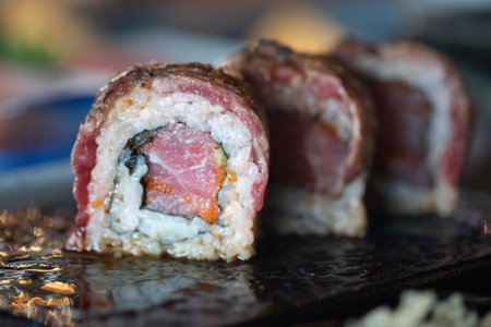 Roast beef sushi serving on black plate. Japanese traditional food.の写真素材