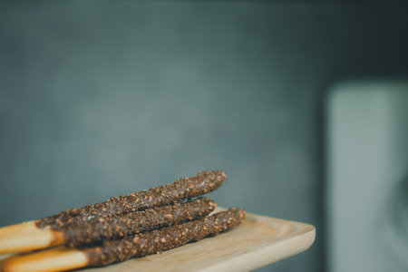 Almond chocolate stick on wooden trayの写真素材