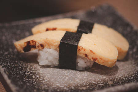 Sushi Tamago egg  with wrapped nori. Japanese foodの写真素材
