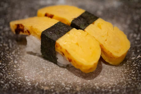 Sushi Tamago egg  with wrapped nori. Japanese foodの写真素材