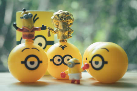 Samut Prakan, Thailand - July 14, 2020 : Happy Meal Collection new promotions of Cute minion in capsule from McDonalds. It Rare item of golden colourのeditorial素材