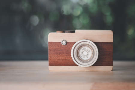 Vintage style of Toy wood camera on wood tableの写真素材