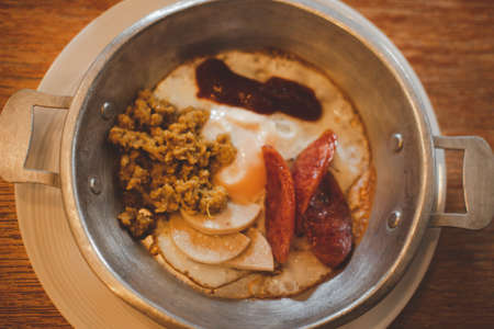 Thai Breakfast - Close up of fried egg in the panの写真素材