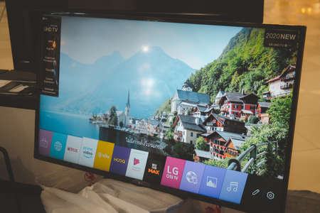 Samut Prakan, Thailand - July 20, 2020 : The new TV in 2020 from LG is  model of LG UHD TV AI ThinQ 50 inch shows the demo picture in an electronic shopのeditorial素材