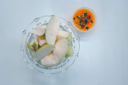 Slice of Guava fruit with with sweet sauce is a delicious menu. Thai style appetizer homemadeの写真素材