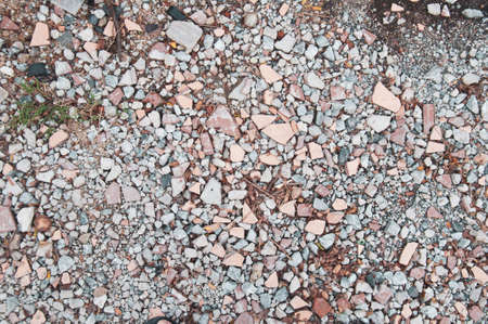 The scrap shredded tiles and stones. Top view abstract, broken scrap tile