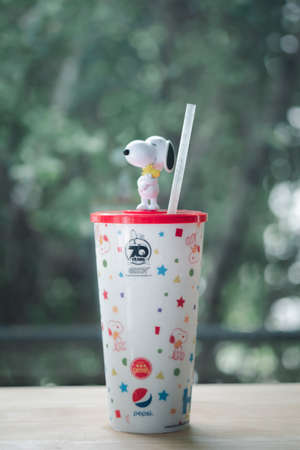 Samut Prakan, Thailand - August 16,  2020 : Celebrating 70 years of Chester's X Snoopy, a snoopy mug with drinks is only 129 baht from Chester's Grill restaurant on wood tableのeditorial素材