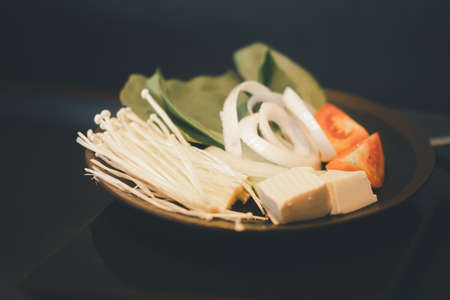 Bowl of fresh vegetable for shabu hotpot or Japanese sukiyakiの写真素材