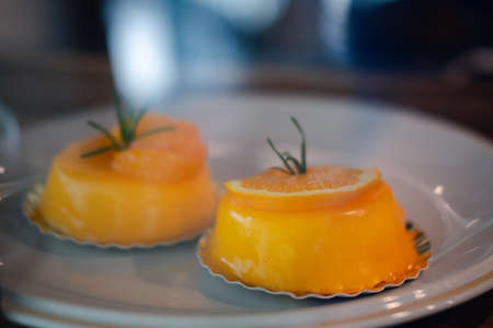 Close up of a delicious orange cake in coffee shopの写真素材