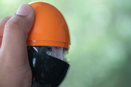 Egg shape made from plastic orange-black colour and open inside some mini toy to surprise and...