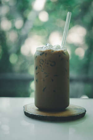 Iced mocha coffee with nature background in coffee shopの写真素材