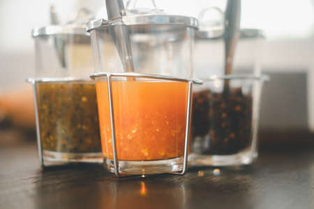 Thai style seasoning garnish at local noodle shop on wood table