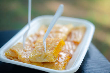 Roti bread sweetened condensed milk with filling Foi thong put on foam tray. Fusion Rotiの写真素材
