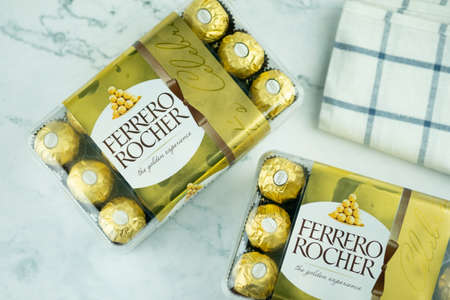 Bangkok, Thailand - October 7, 2020 : Ferrero Rocher - round chocolates. Candy in branded packaging,...