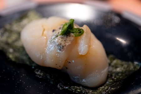 Japanese sushi scallops served on seaweed sheet. Selective focusの写真素材