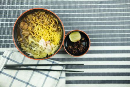 Noodle Khao Soi with chicken in bowl is one of the traditional food of northern Thailandの写真素材