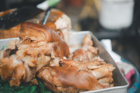 Stewed pork leg and chinese kale on tray. Select focus