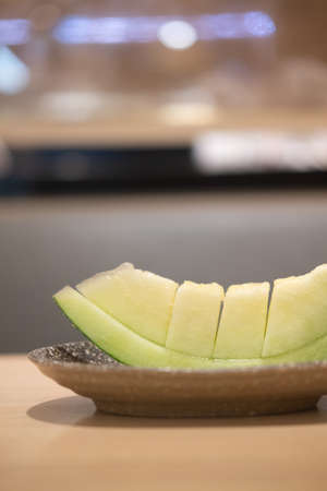 Juicy slice cantaloupe Japanese on plate.の写真素材