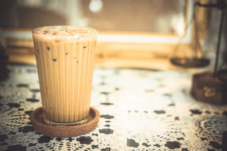 Iced latte coffee in glasses on table. Summer cold refreshing drink conceptの写真素材