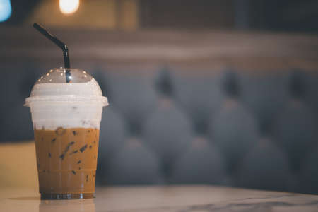 Cool of cappuccino coffee cup on table in cafeの写真素材