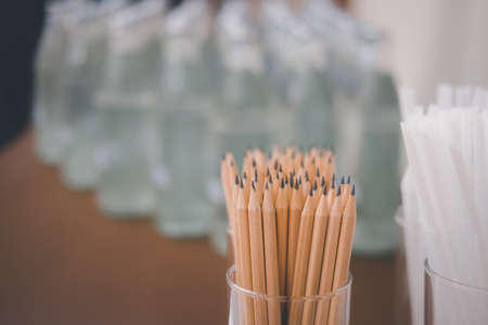 Stock of brown pencil in glass prepared for seminar or business meetingの写真素材