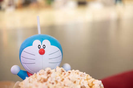 Bangkok, Thailand - November 22, 2020 : Cute toy of Doraemon set of bucket popcorn and soft drink to promote the movie : Nobita's New Dinosaur from Advertising Major Cineplex Group Plc.のeditorial素材