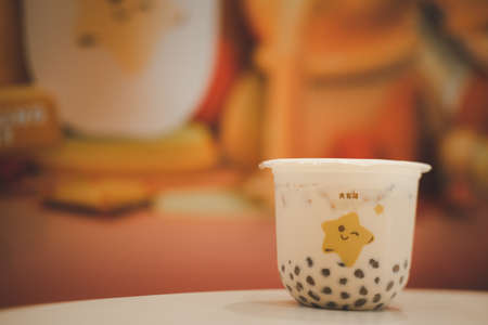 Samut Prakan, Thailand - November 30, 2020 : Bubble milk tea on table from Dakasi cafe, new productのeditorial素材