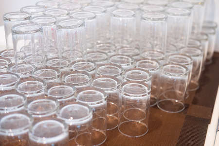 Empty drink glass in restaurant or buffet line.