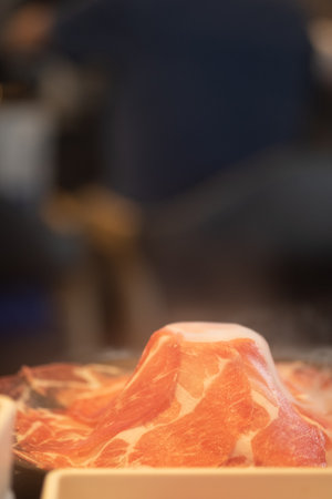 Close up premium sliced Kurobuta pork served for Sukiyaki and Shabuの写真素材
