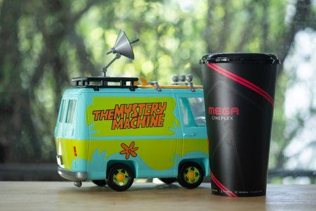 Bangkok, Thailand - December 12, 2020 : Scooby doo the mystery machine car diecast and glass of soft...