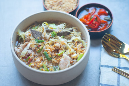 Egg noodle soup with many fresh vegetable and many topping, Thai noodle styleの写真素材