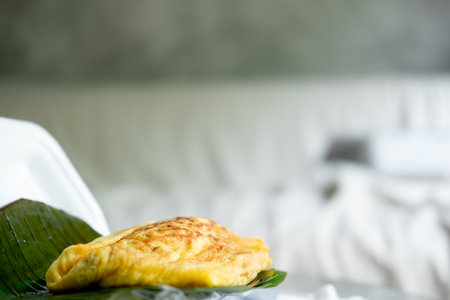 Vietnamese stuffed crispy omelet on banana leaf.の写真素材