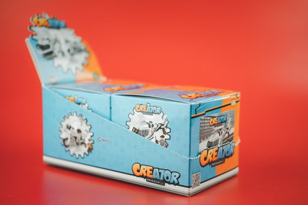 Samut Prakan, Thailand - December 27, 2020 : Blocks toy Thai police motorcycle and helicopter from LOZ Creator in box collect all 2 items on red backgroundのeditorial素材