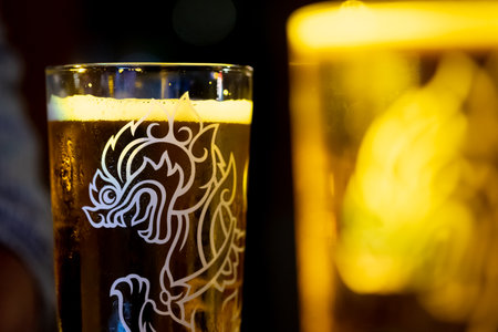 Chiang Mai, Thailand - December 27, 2020 : Close up a glass of cold Singha beer. Selective focusのeditorial素材
