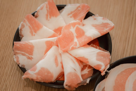 Fresh of thinly sliced of raw pork for hot pot also known as Shabu Shabu or Sukiyaki, Japanese food...